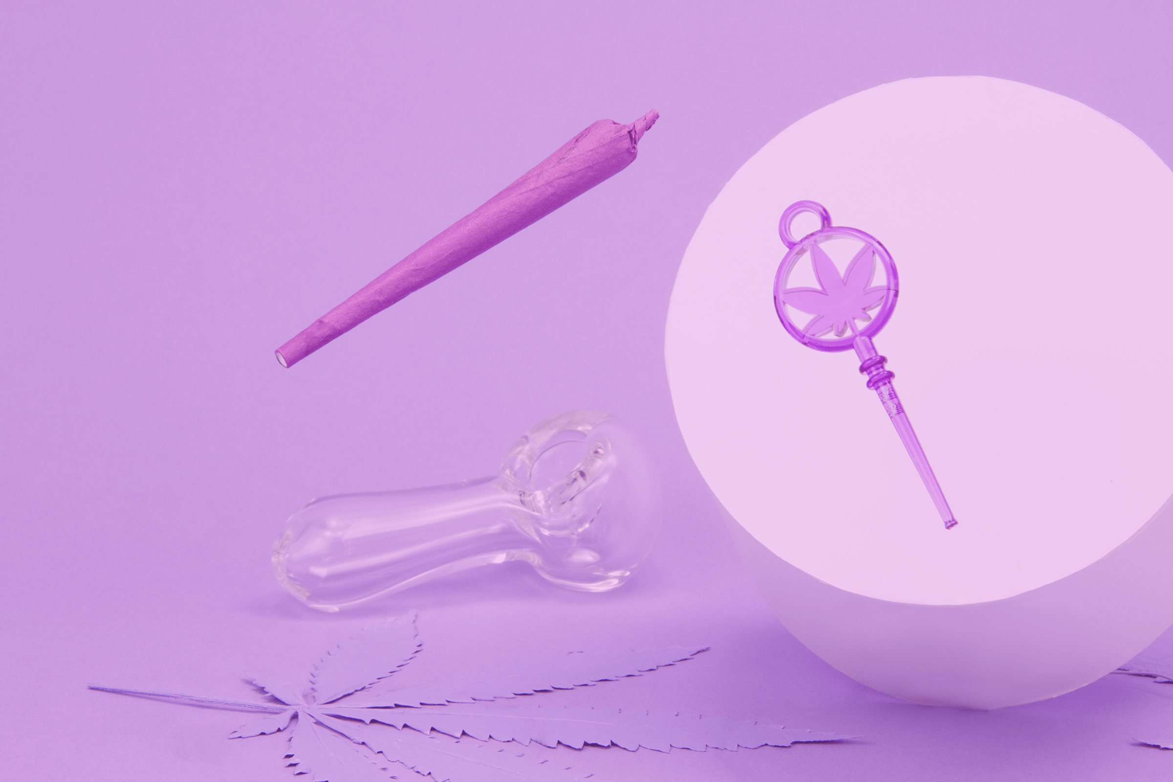 Purple Kush Key floating over purple background with a rolled purple joint and clear glass pipe